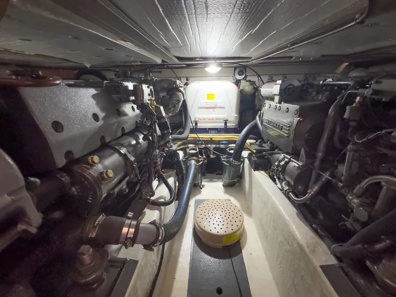 Slide: The Image of Engine room of the 2002 Sabre 36 Express with two large engines. - 49