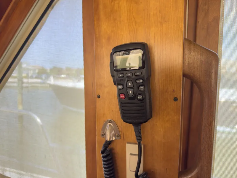 Slide: The Image of A radio is mounted on a wooden wall inside a boat. - 15