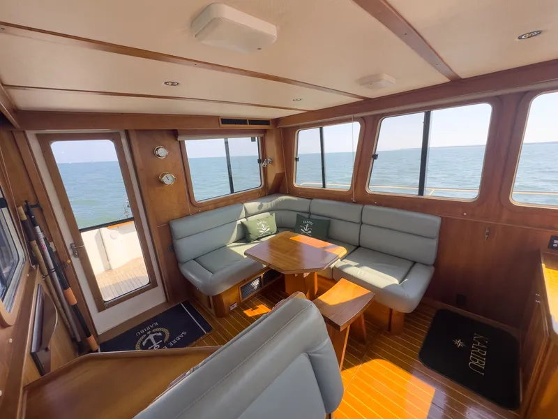Slide: The Image of Interior of a 2002 Sabre 36 Express with wood finish and blue upholstery. - 5