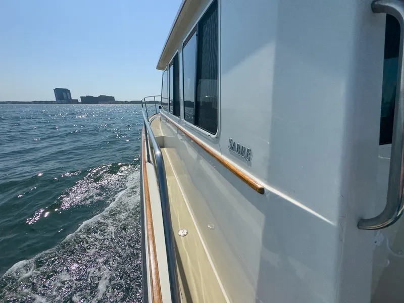 Slide: The Image of Side view of a 2002 Sabre 36 Express on the water. - 37