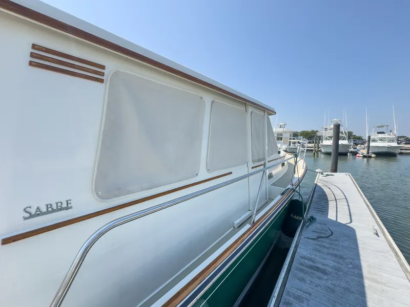 Slide: The Image of The 2002 Sabre 36 Express is docked. It features a sleek design with clean lines. - 46