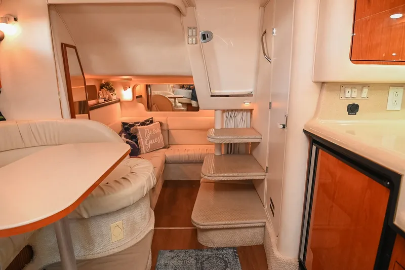 Slide: The Image of Luxurious interior of 2001 Sea Ray 340 Sundancer yacht with cozy seating and elegant decor. - 38