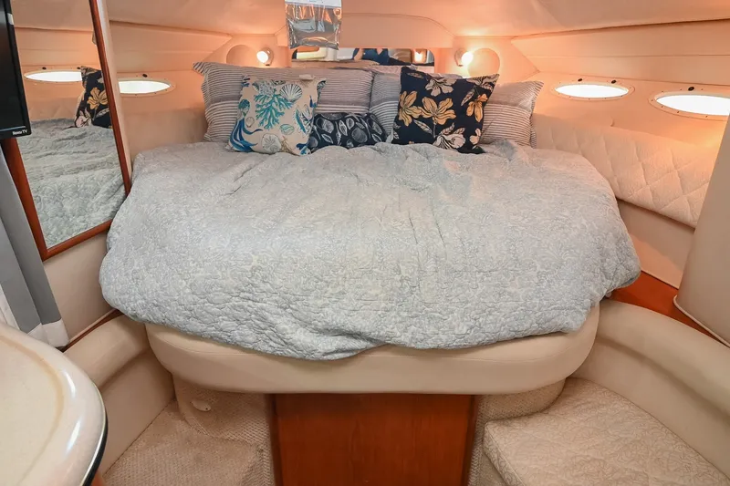 Slide: The Image of Luxurious cabin interior of 2001 Sea Ray 340 Sundancer with cozy bedding and pillows. - 34