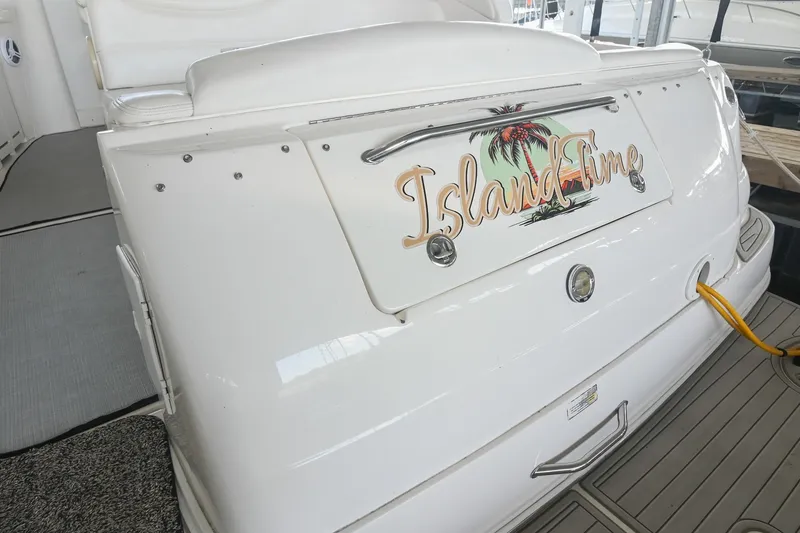 Slide: The Image of 2001 Sea Ray 340 Sundancer boat with "Island Time" decal on the stern. - 6