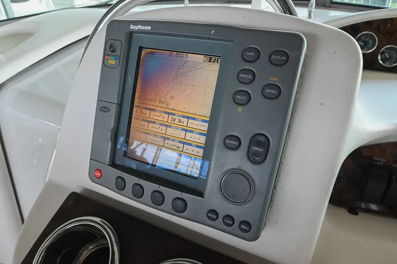 Slide: The Image of Raytheon marine navigation system on 2001 Sea Ray 340 Sundancer boat dashboard. - 21