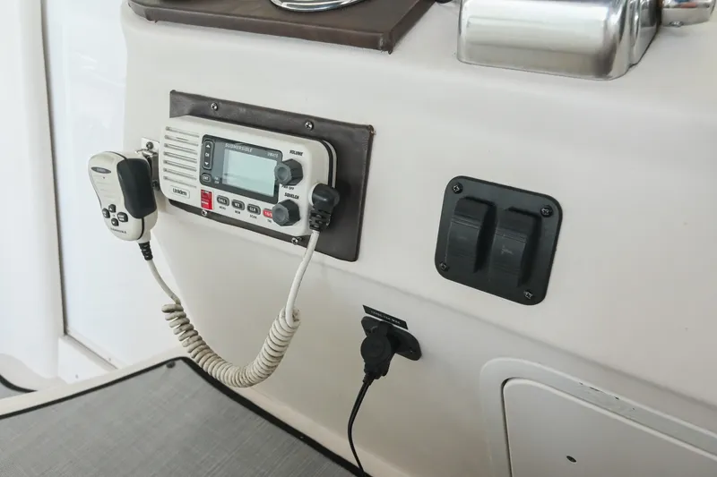Slide: The Image of Control panel of a 2001 Sea Ray 340 Sundancer boat with radio and switches. - 20