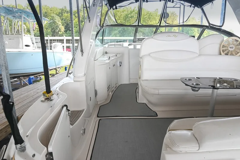 Slide: The Image of 2001 Sea Ray 340 Sundancer interior with white seating and sleek design. - 7