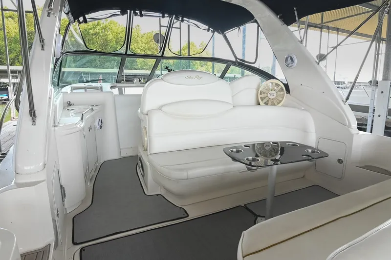 Slide: The Image of 2001 Sea Ray 340 Sundancer interior with white seating and sleek design. - 8