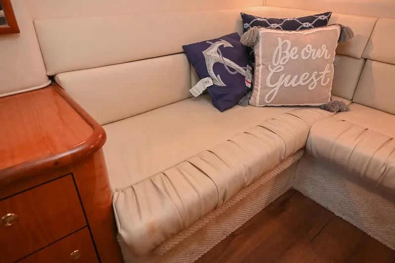 Slide: The Image of Cozy seating area on 2001 Sea Ray 340 Sundancer with decorative pillows. - 40