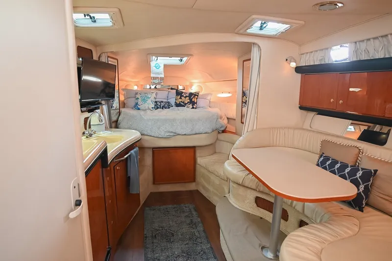 Slide: The Image of Luxurious interior of 2001 Sea Ray 340 Sundancer yacht with cozy seating and elegant decor. - 24