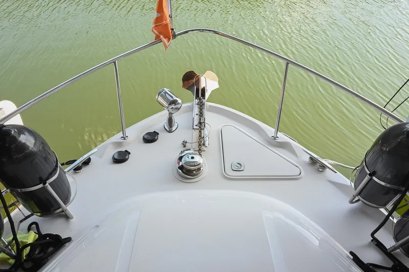 Slide: The Image of Bow view of 2001 Sea Ray 340 Sundancer on calm water. - 53