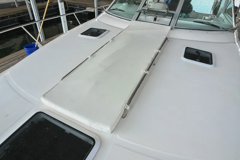 Slide: The Image of 2001 Sea Ray 340 Sundancer boat deck with hatches and sunpad. - 52