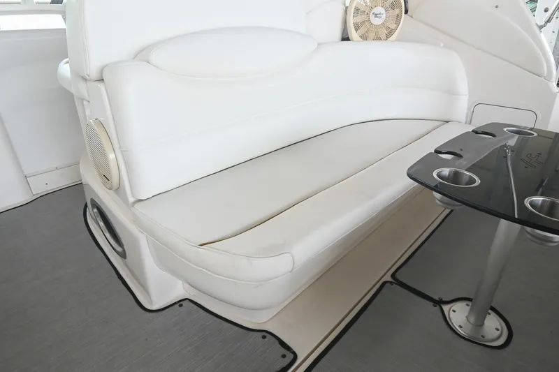 Slide: The Image of White seating area on 2001 Sea Ray 340 Sundancer yacht with table and cup holders. - 11
