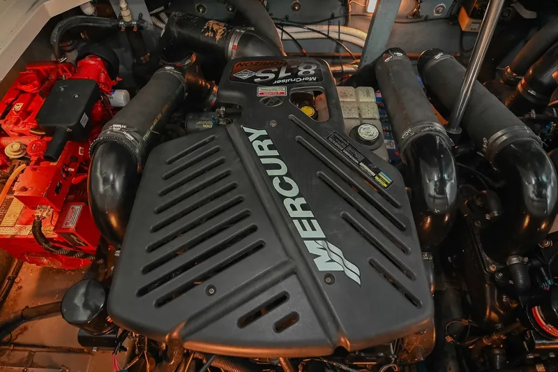 Slide: The Image of Engine compartment of a 2001 Sea Ray 340 Sundancer with Mercury motor. - 47