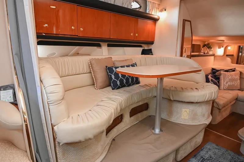 Slide: The Image of Interior of 2001 Sea Ray 340 Sundancer yacht with plush seating and elegant decor. - 27