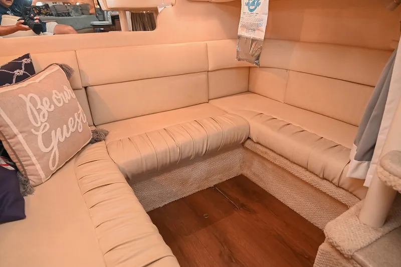Slide: The Image of Interior of 2001 Sea Ray 340 Sundancer with beige seating and decorative pillows. - 41