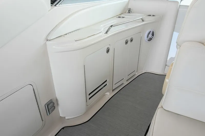 Slide: The Image of Interior view of a 2001 Sea Ray 340 Sundancer yacht with sleek white cabinetry. - 13