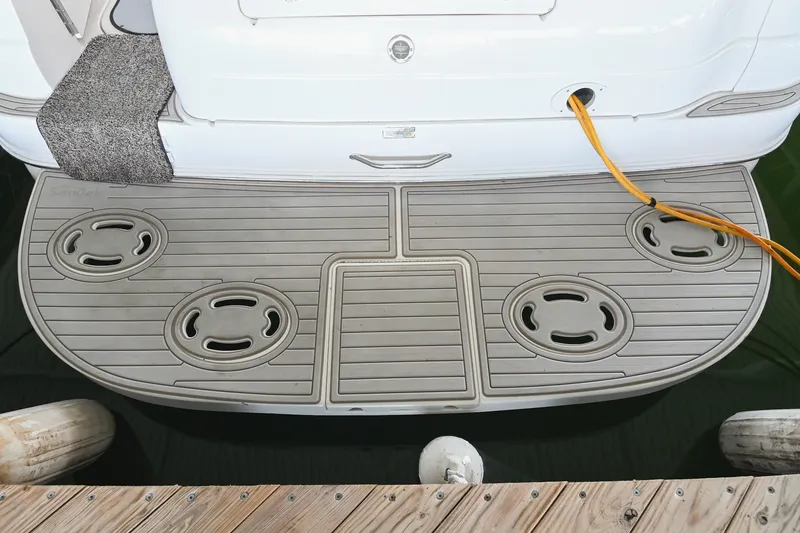 Slide: The Image of Swim platform of 2001 Sea Ray 340 Sundancer with power cable and dock view. - 5