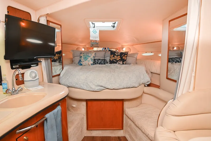 Slide: The Image of Luxurious interior cabin of 2001 Sea Ray 340 Sundancer with cozy bed and modern amenities. - 32