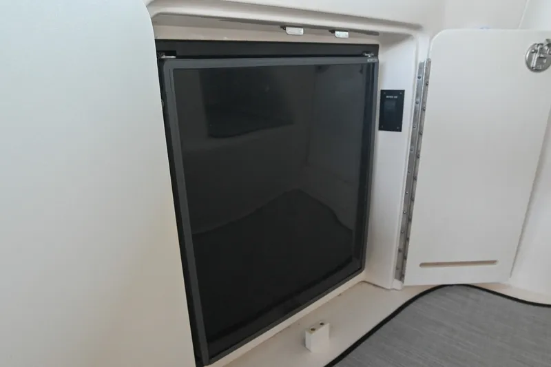 Slide: The Image of Built-in refrigerator on a 2001 Sea Ray 340 Sundancer yacht interior. - 14