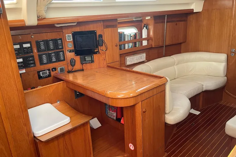 Slide: The Image of Interior of 2006 Jeanneau Sun Odyssey 45 yacht with wood finish and navigation equipment. - 15