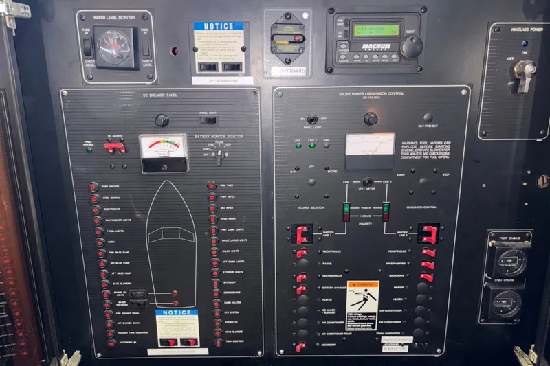 Slide: The Image of Control panel of a 1996 Bayliner 3587 Motoryacht with various switches and gauges. - 15