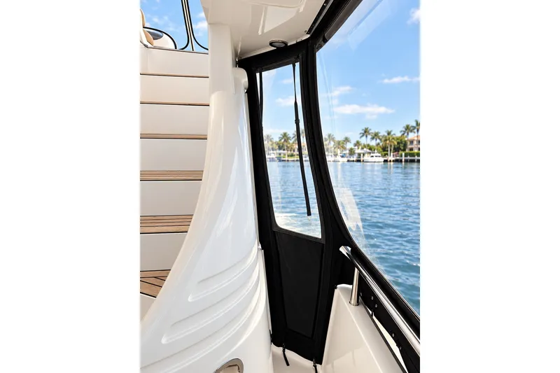 Slide: The Image of Staircase view on 2003 Horizon 62 Motor Yacht, overlooking serene waterfront scenery. - 71