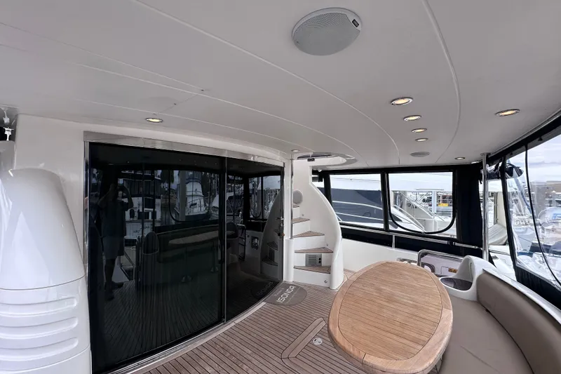 Slide: The Image of Spacious deck of 2003 Horizon E62 Motor Yacht with elegant wood flooring and modern design. - 84