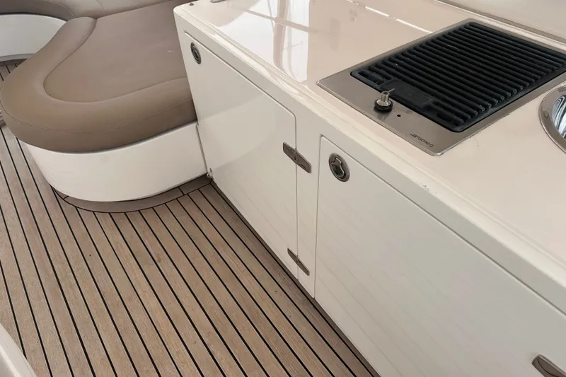 Slide: The Image of Luxury yacht deck with seating and built-in grill, Horizon E62 Motor Yacht, 2003 model. - 77