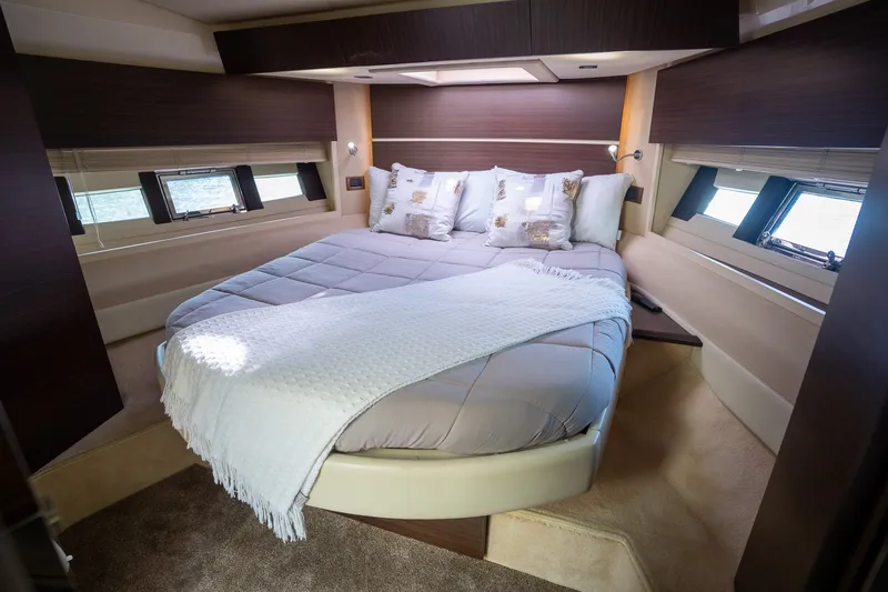 Slide: The Image of Luxurious bedroom interior of a 2014 Azimut 48 yacht with elegant bedding and natural light. - 14