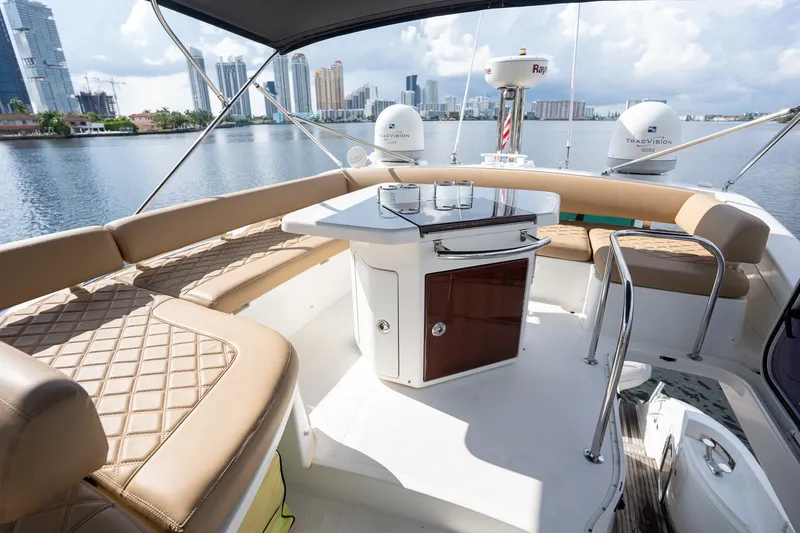 Slide: The Image of Luxurious 2014 Azimut 48 yacht interior with elegant seating and city skyline view. - 33