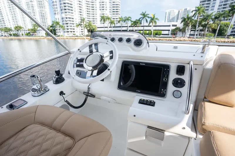 Slide: The Image of Helm of 2014 Azimut 48 yacht with modern controls and luxurious seating. - 30