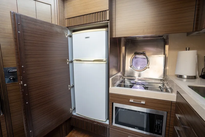 Slide: The Image of Luxurious 2014 Azimut 48 yacht kitchen with fridge, stove, and microwave. - 20