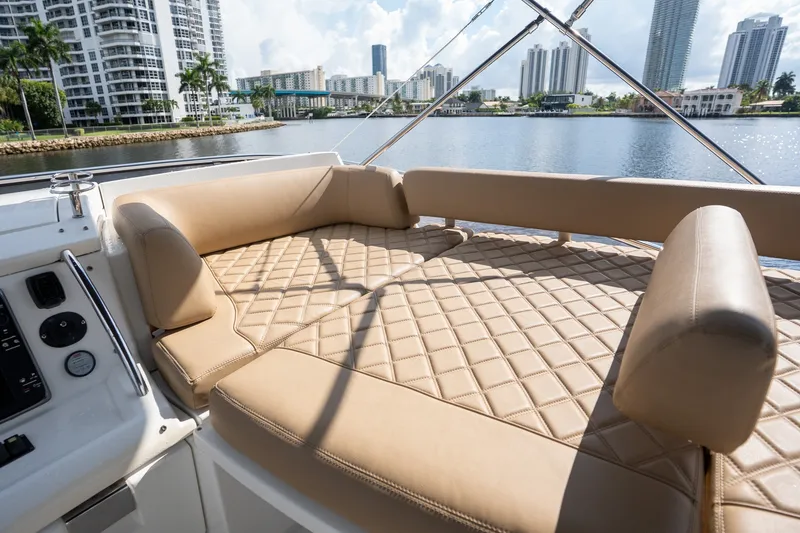 Slide: The Image of Luxurious seating on a 2014 Azimut 48 yacht with city skyline in the background. - 32