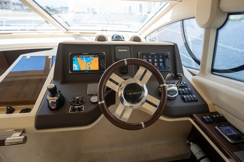 Slide: The Image of Cockpit of 2014 Azimut 48 yacht with navigation controls and steering wheel. - 26