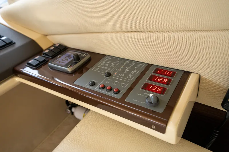 Slide: The Image of Control panel of a 2014 Azimut 48 yacht with digital displays and switches. - 24