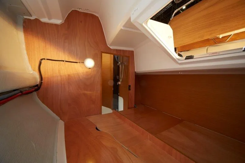 Slide: The Image of Interior cabin of 2023 Jeanneau Sun Odyssey 349 sailboat with wooden finish. - 23