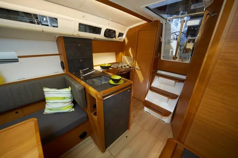 Slide: The Image of 2023 Jeanneau Sun Odyssey 349 interior with modern kitchen and cozy seating area. - 20