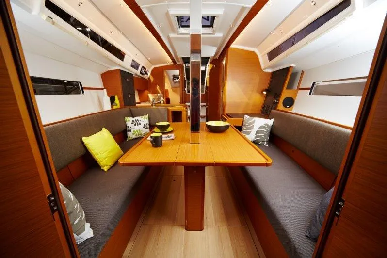 Slide: The Image of Interior of 2023 Jeanneau Sun Odyssey 349 sailboat with cozy seating and dining area. - 19