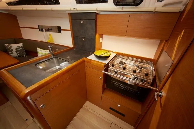 Slide: The Image of Modern kitchen area in 2023 Jeanneau Sun Odyssey 349 sailboat. - 21