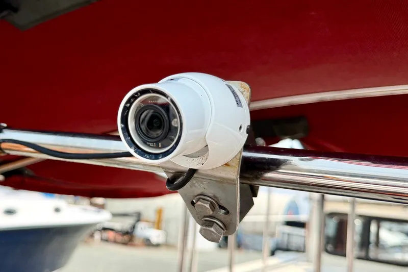 Slide: The Image of Security camera mounted on a 1993 Nordic Tug 32 boat railing. - 49
