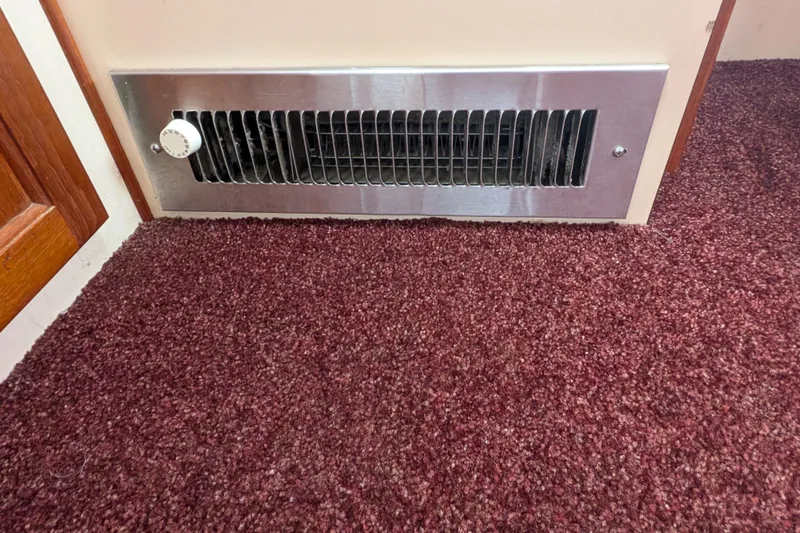 Slide: The Image of Ventilation grille on 1993 Nordic Tug 32 with maroon carpet flooring. - 17