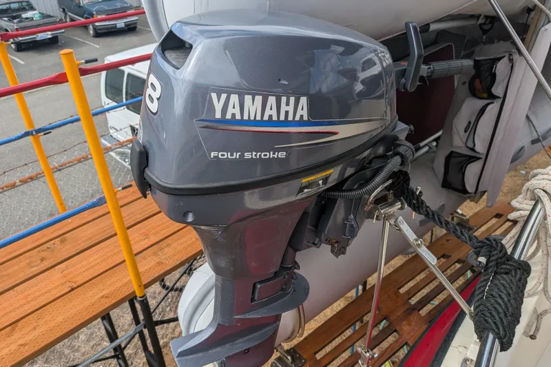 Slide: The Image of Yamaha four-stroke outboard motor on a 1993 Nordic Tug 32 boat. - 51