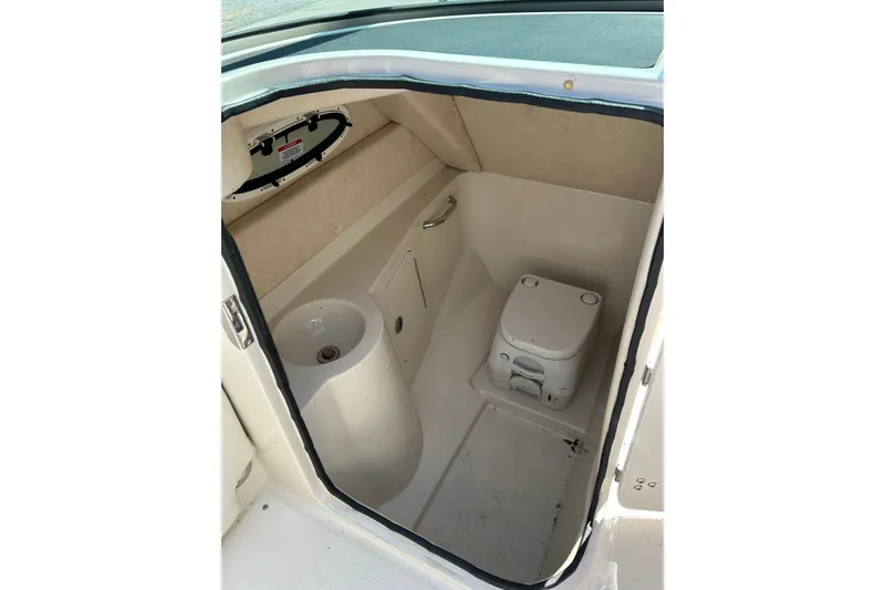 Slide: The Image of Interior of 2010 Sea Ray 260 Sundeck boat with compact toilet and sink. - 18