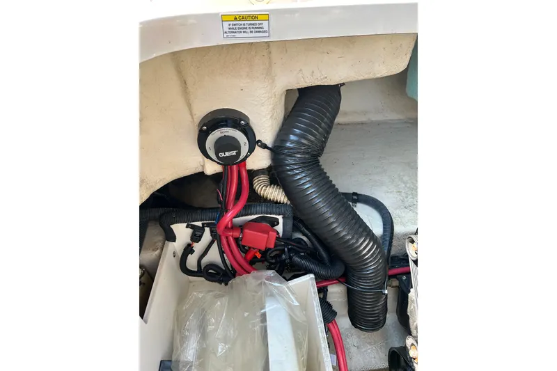 Slide: The Image of Engine compartment of a 2010 Sea Ray 260 Sundeck with wiring and ventilation hose. - 37