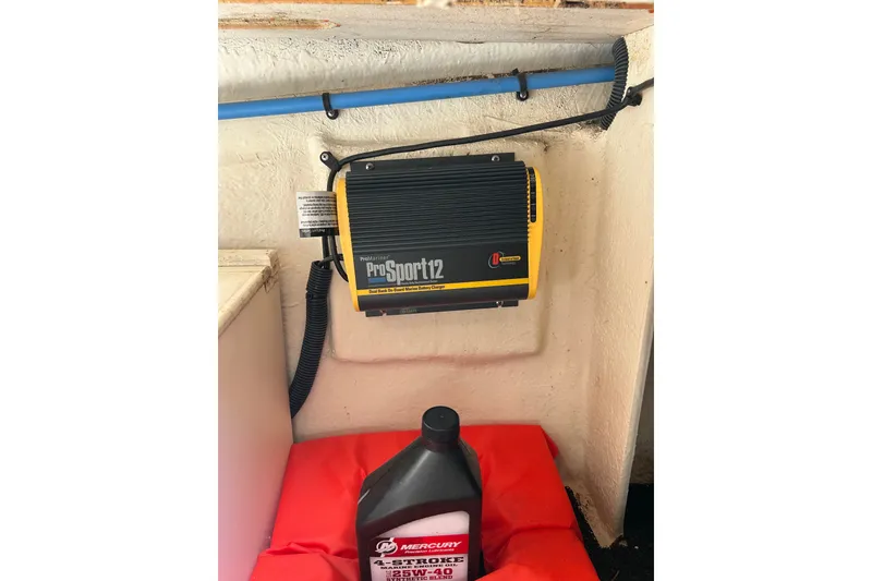 Slide: The Image of ProSport12 battery charger and Mercury 4-stroke oil in a 2010 Sea Ray 260 Sundeck. - 38