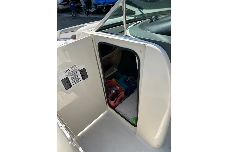 Slide: The Image of Open storage compartment on a 2010 Sea Ray 260 Sundeck boat. - 19