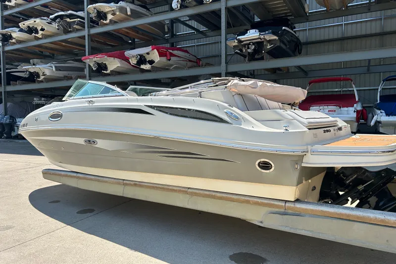 Slide: The Image of 2010 Sea Ray 260 Sundeck boat in storage facility, side view. - 12