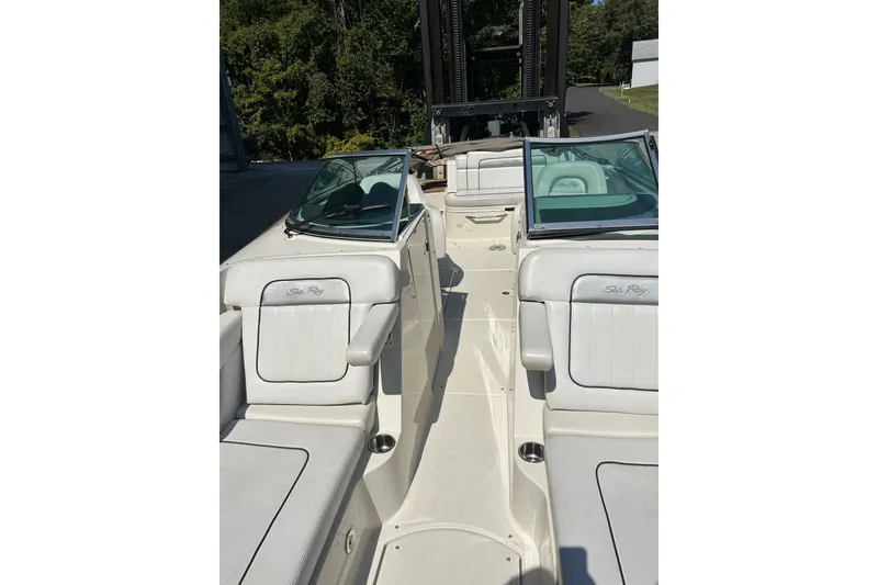 Slide: The Image of 2010 Sea Ray 260 Sundeck boat interior with white seating and windshield. - 21