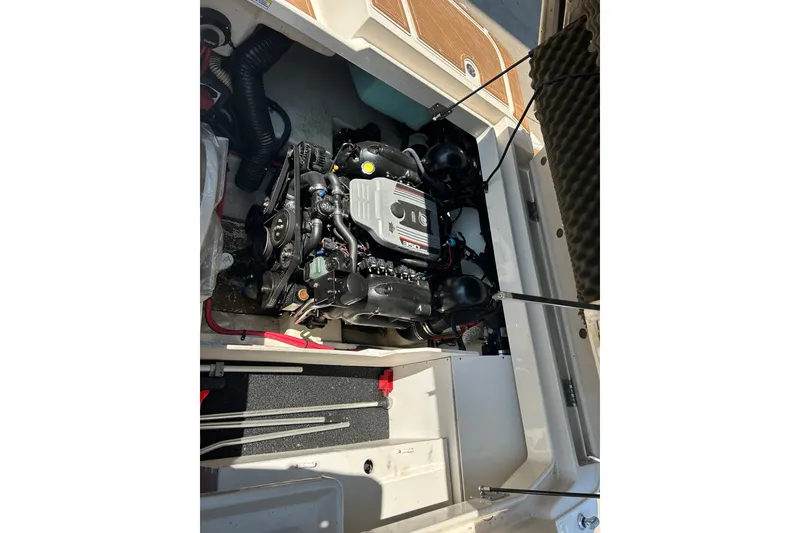 Slide: The Image of Engine compartment of a 2010 Sea Ray 260 Sundeck boat, showcasing the engine details. - 35
